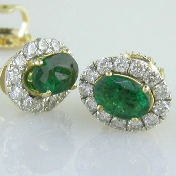 14k emerald and diamond halo style earrings